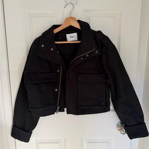 TNA Black Jacket Label Close-Up